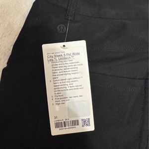 New with tags black Lululemon pants. Black. Size 31. Mid rise wide leg.